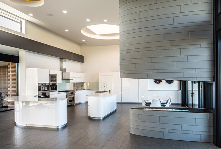 Image of modern kitchen with curved zinc metal fireplace surrounds.